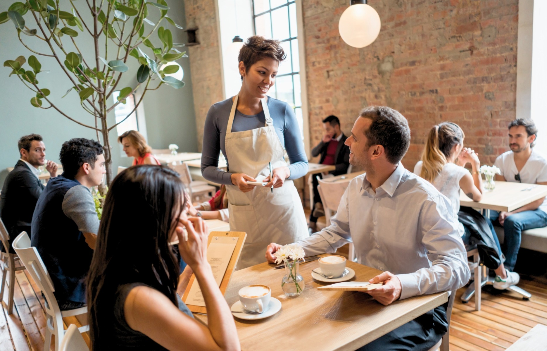 Guests dining at a restaurant — GLP-1 weight-loss drugs are changing eating behavior for a growing share of the dining public, with structural implications for restaurant operators