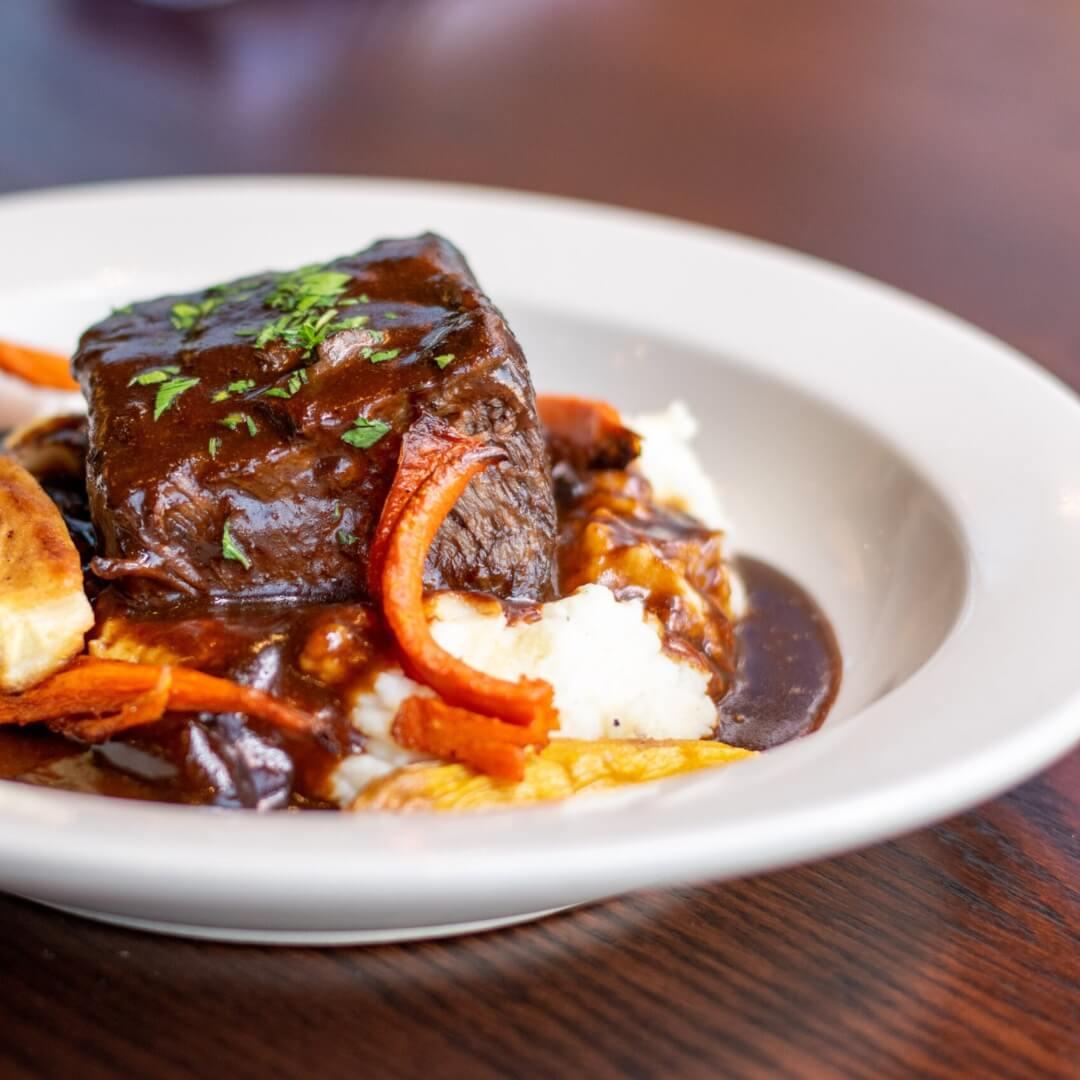 Braised beef with mashed potatoes and vegetables at Garvies Point Brewery, served with industrial dining experience