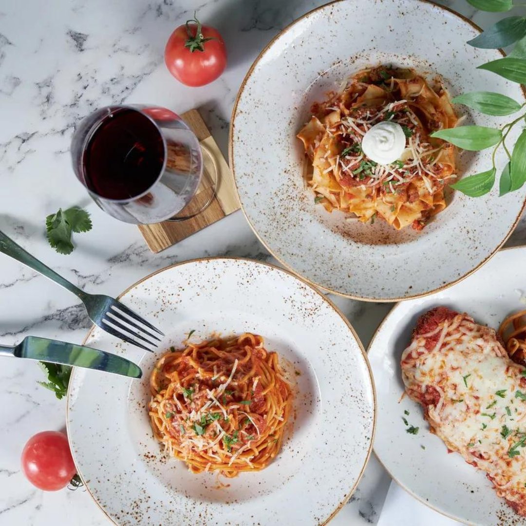 Wine and pasta dishes at Goat and Vine Restaurant