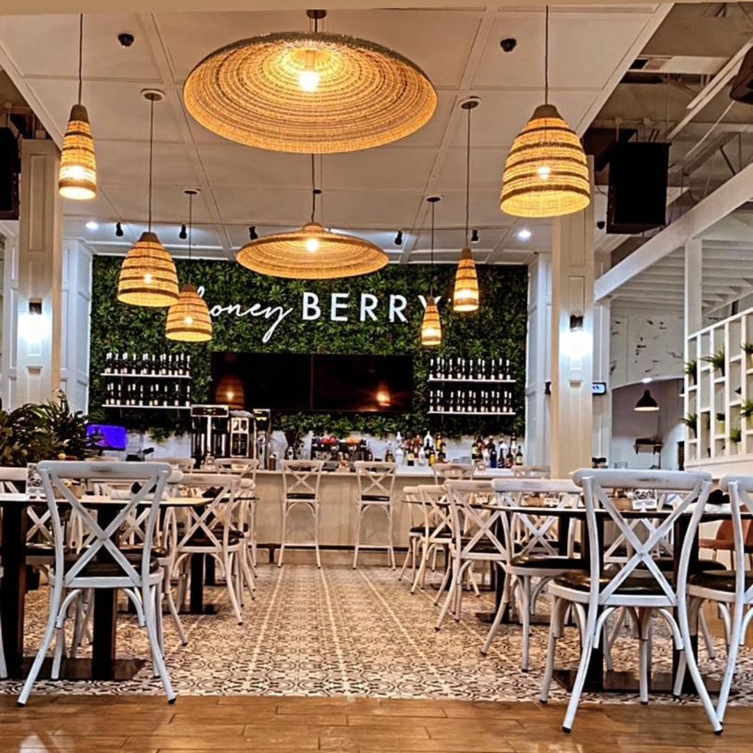 High-volume breakfast service area with commercial furniture at Honey Berry Café