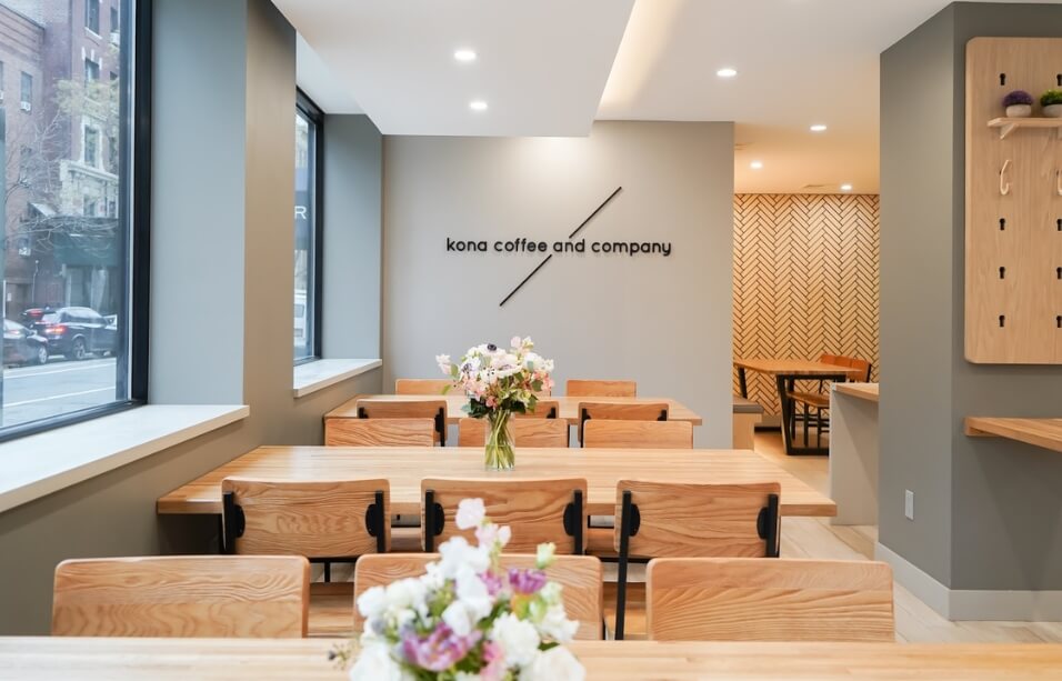 Custom commercial furniture installation optimized for specialty coffee service at Kona Coffee Roasters Chelsea Manhattan