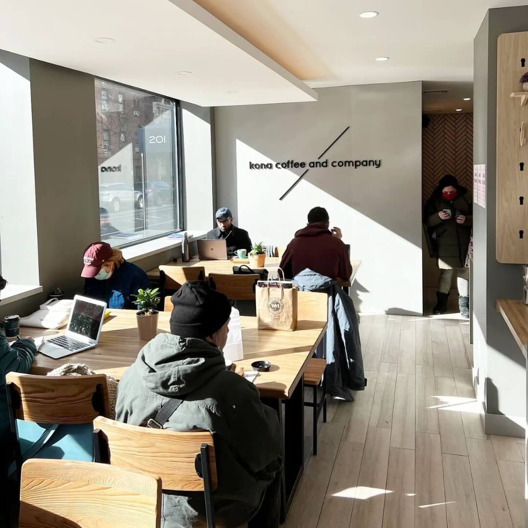 Urban coffee shop window seating designed for New York specialty service