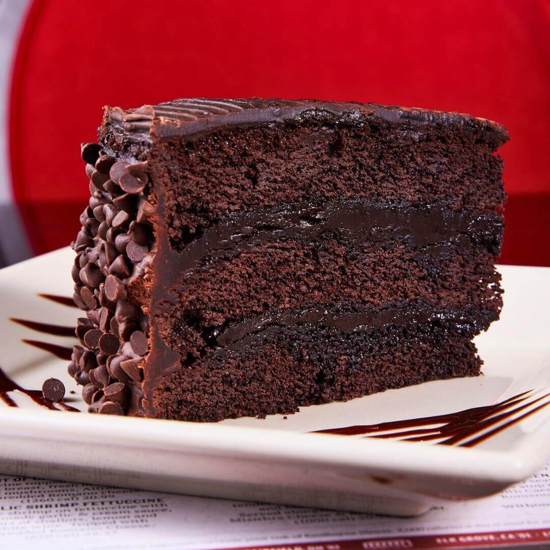 Triple layer chocolate cake dessert with chocolate chips at Old Spaghetti Factory