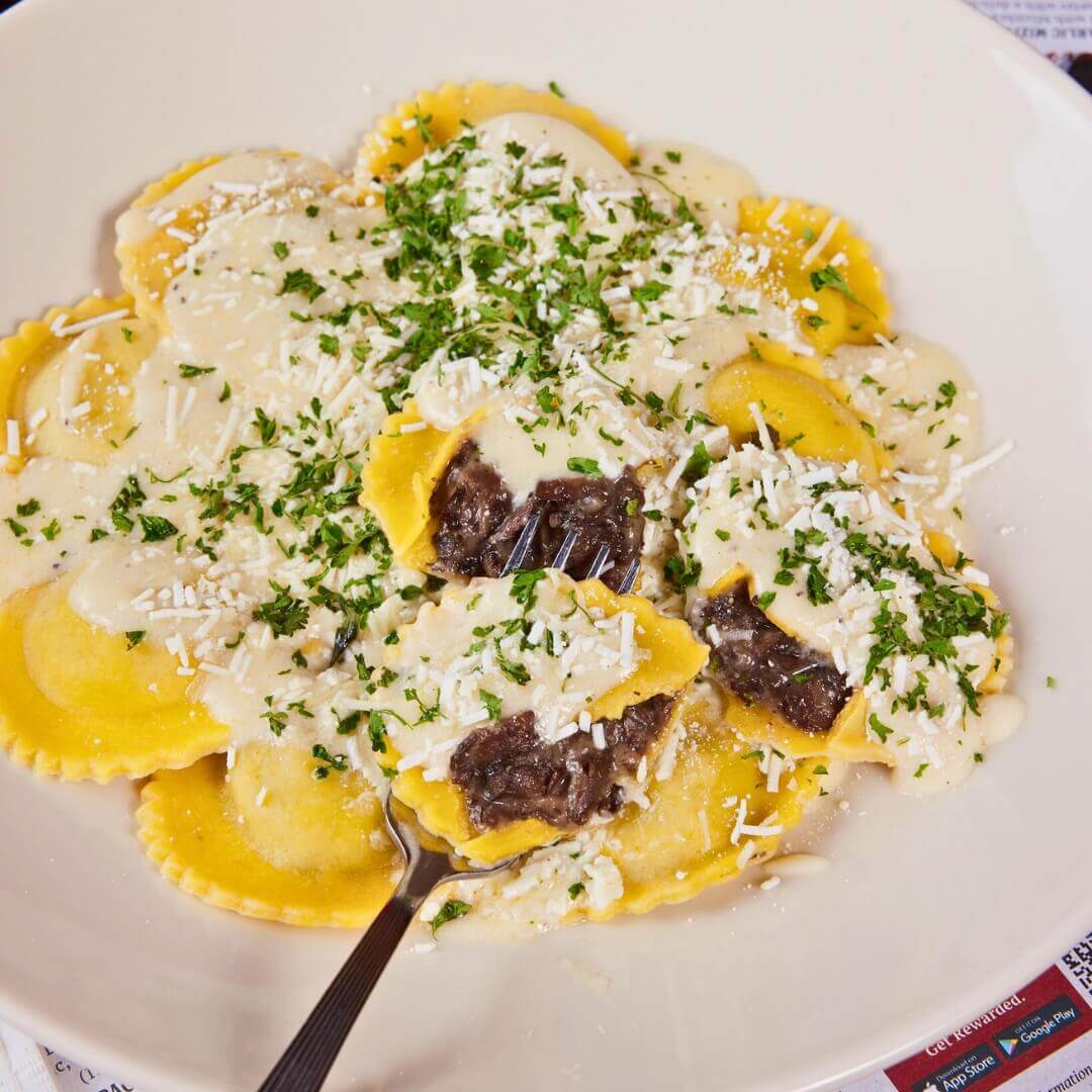 Fresh mushroom ravioli with parmesan cheese and herbs at Old Spaghetti Factory