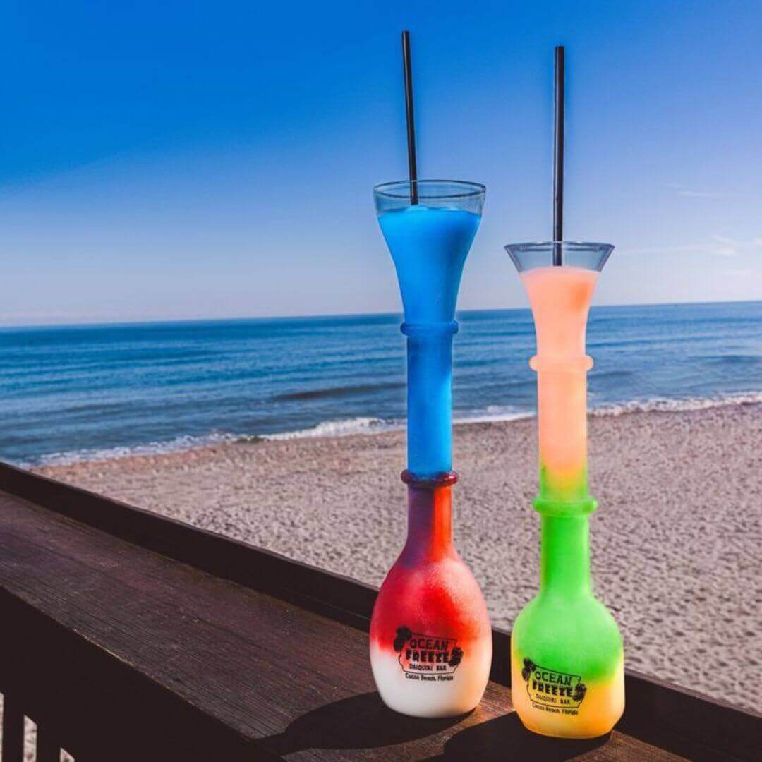 Colorful Ocean Freeze signature cocktails at Pier 62 with beachfront views of Cocoa Beach